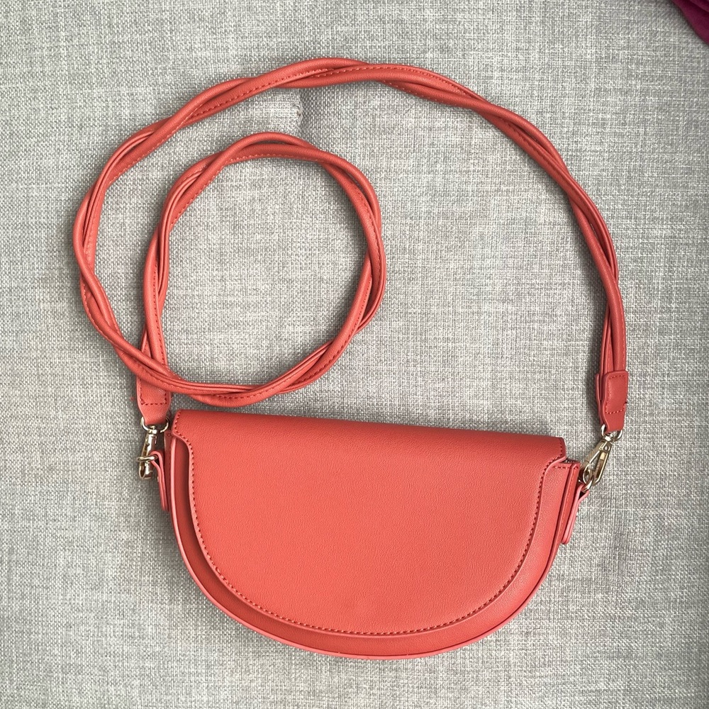 Coral half moon crossbody clutch